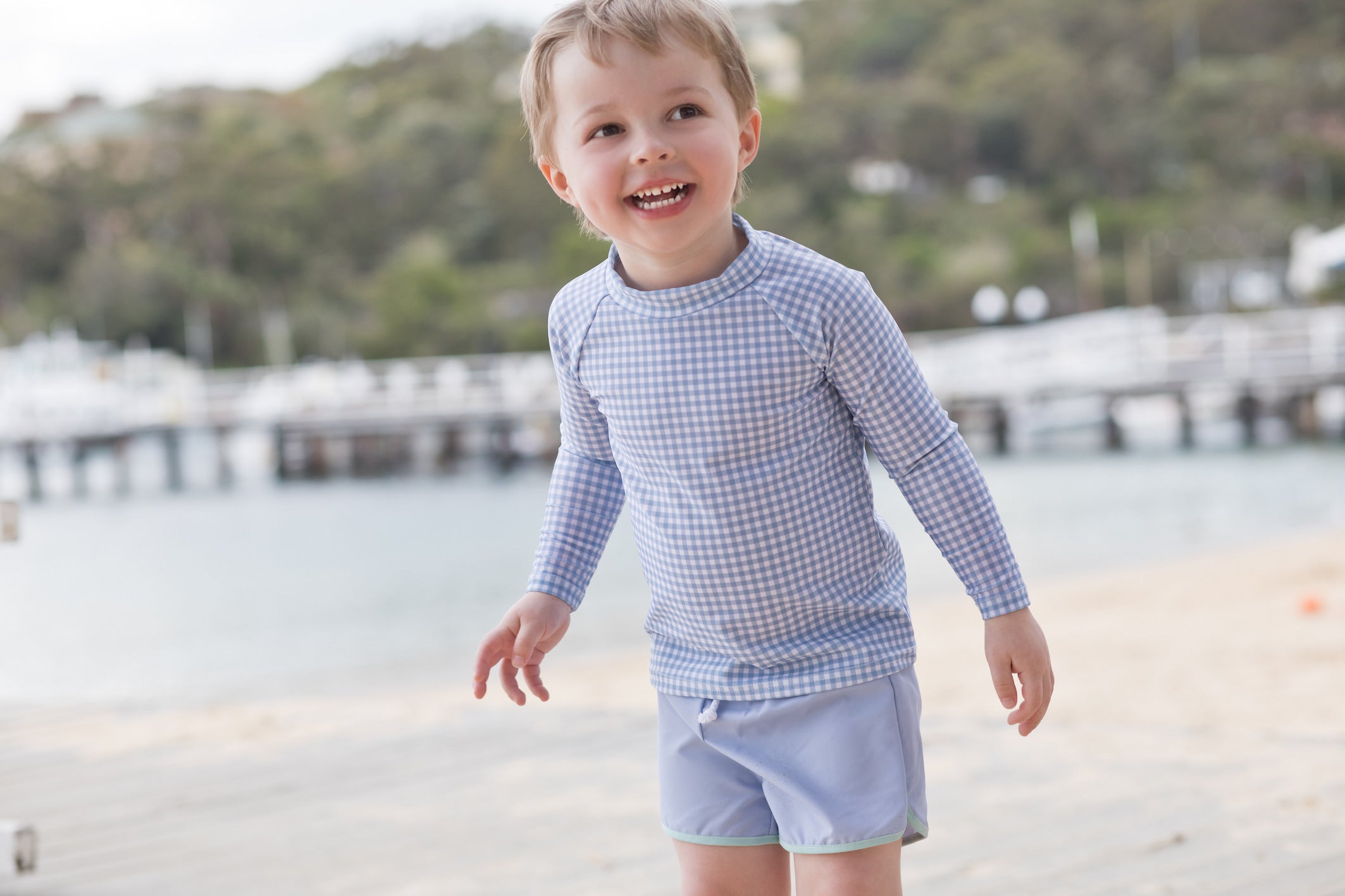 bells blue gingham long sleeve rashguard